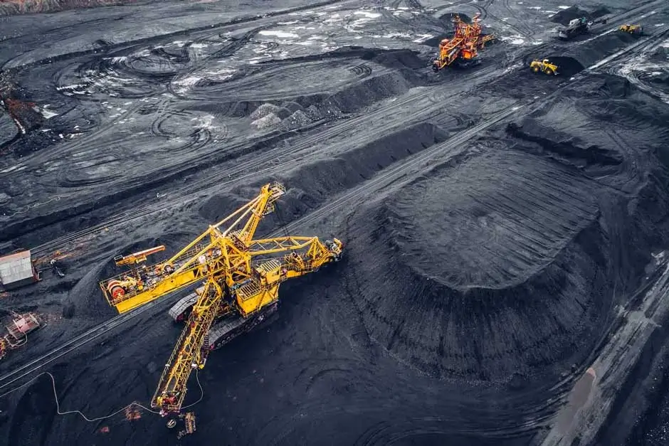 Large scale open pit coal mine with heavy mining equipment, bucket wheel machinery, real time telemetry, SCADA monitoring and digital twin based fleet analytics